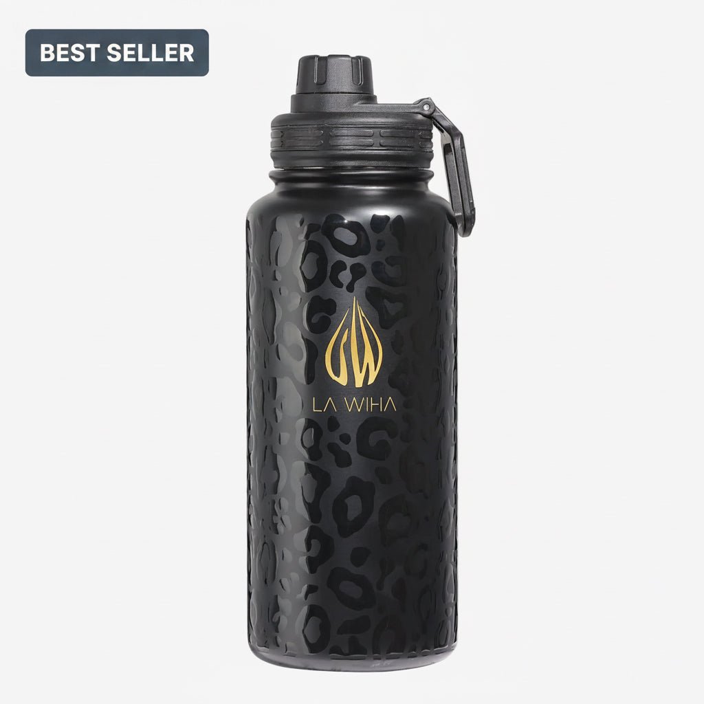 A durable perfect size 32 oz black insulated water bottle with a textured leopard print pattern, a gold La Wiha logo, and a black lid with a sport twist lid with carrying loop, shown on a light gray background with a 'BEST SELLER' badge in the top-left corner.
