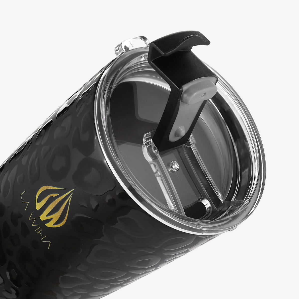Close-up of a black textured insulated tumbler with a clear lid and black flip-top spout, featuring a gold La Wiha logo on a light gray background.
