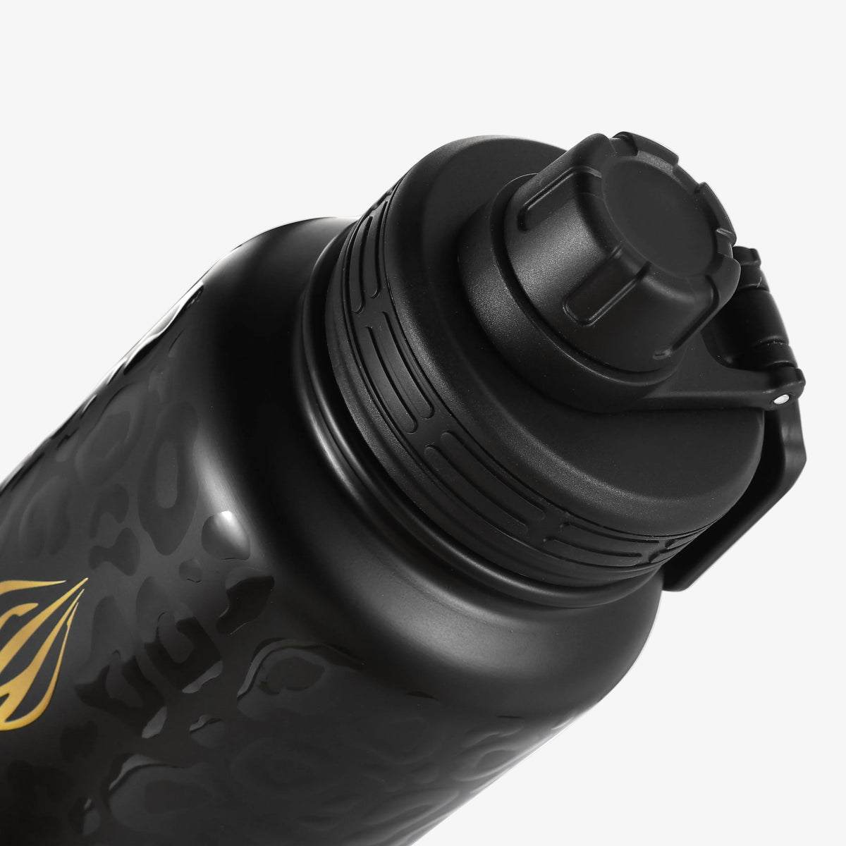 Close-up of a matte black water bottle with a matching black sport lid and a subtle gold graphic on the side, set against a clean white background.