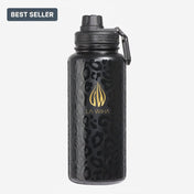 A durable perfect size 32 oz black insulated water bottle with a textured leopard print pattern, a gold La Wiha logo, and a black lid with a sport twist lid with carrying loop, shown on a light gray background with a 'BEST SELLER' badge in the top-left corner.