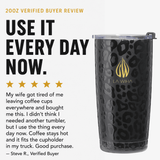 A black leopard-print insulated tumbler with a clear lid and a gold LA WIHA logo, shown beside promotional text reading 'USE IT EVERY DAY NOW.' and a verified buyer review on a light gray background. 20oz review use it every day now. My wife got tired of me leaving my coffee cups everywhere and bought me this. I didnt think I needed another tumbler but I use the thing every day now. Coffee stays hot and it fits the cupholder in my truck. Good purchase