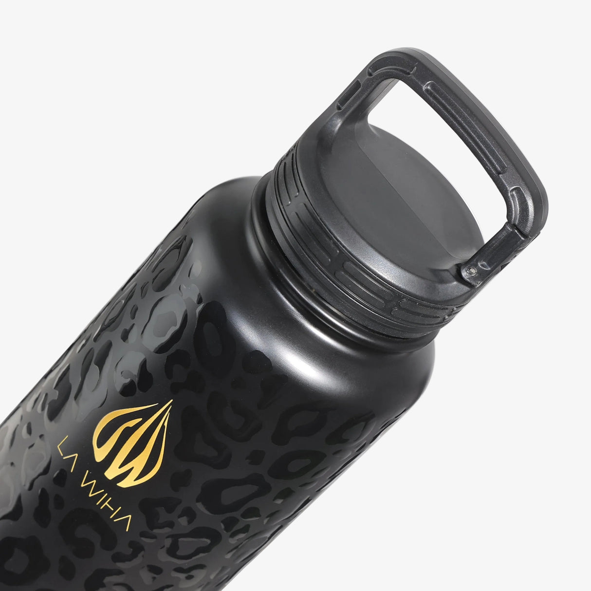 A close-up of a matte black water bottle with a subtle leopard pattern, featuring a gold 'LA WIHA' logo. The bottle is shown at an angle with its carabiner clip lid closed position