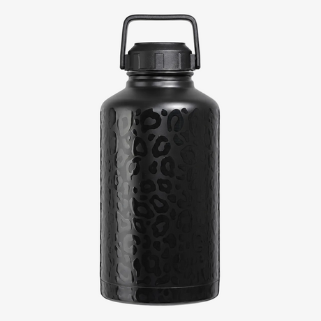A leopard print insulated water bottle with a textured leopard print pattern and a black carrying handle lid, shown on a solid white background. 

Stainless steel, durable, insulation, water bottle, water bottles, water jug, best water bottle, 64oz insulated water bottle perfect water bottle
