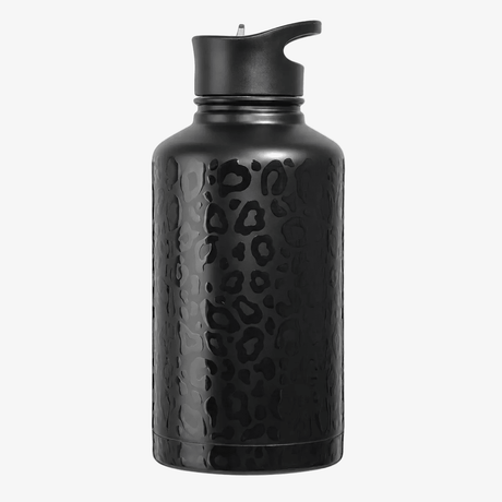 A matte 64 ounce half gallon black insulated water bottle jug with a textured, 3D finish  black leopard print pattern, featuring a drinking straw lid shown on a solid white background.